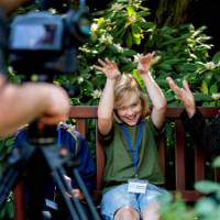 Student and interviewer having fun being filmed about a Groundswell project.